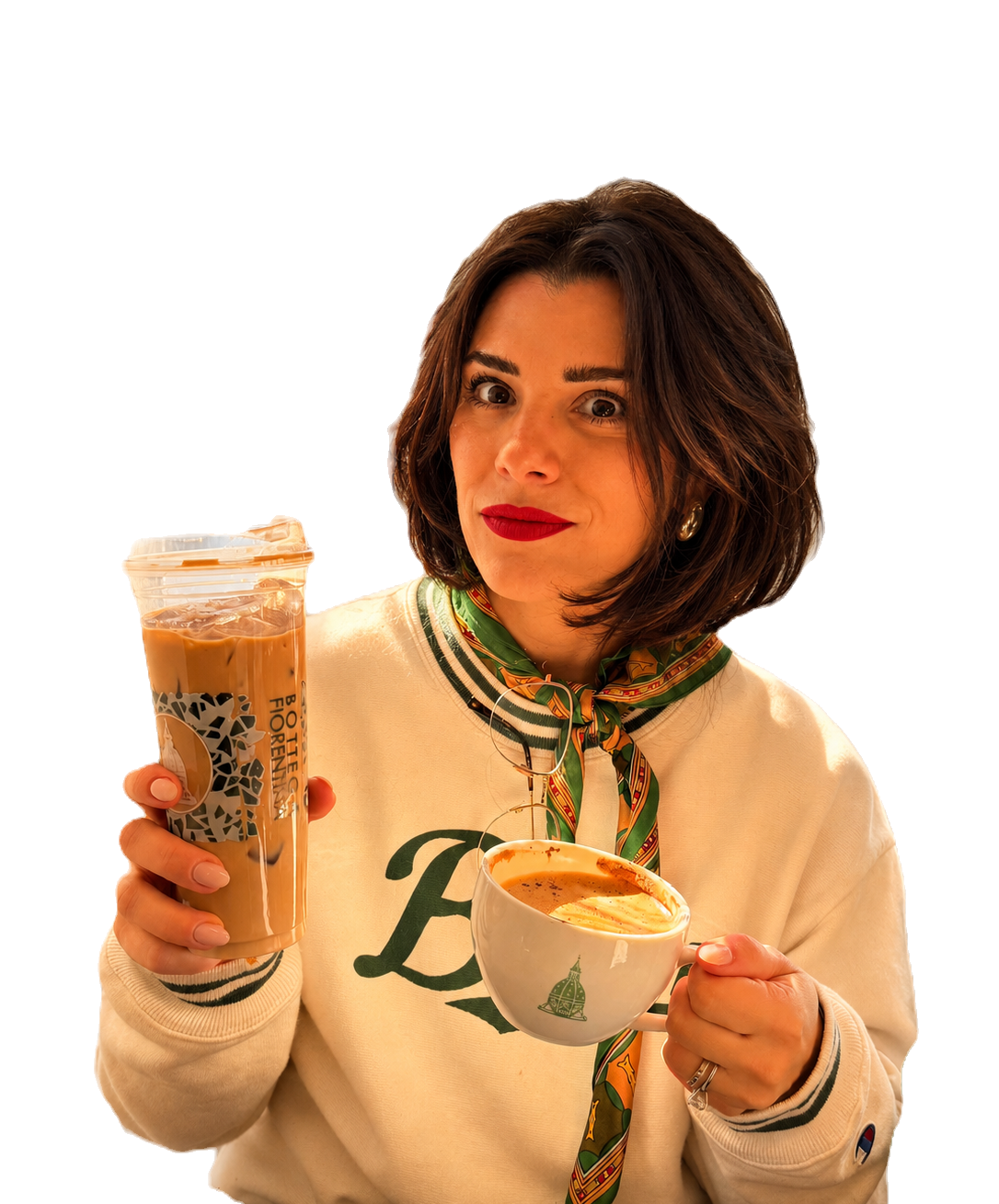 A Bottega guest holding a cappuccino and iced coffee