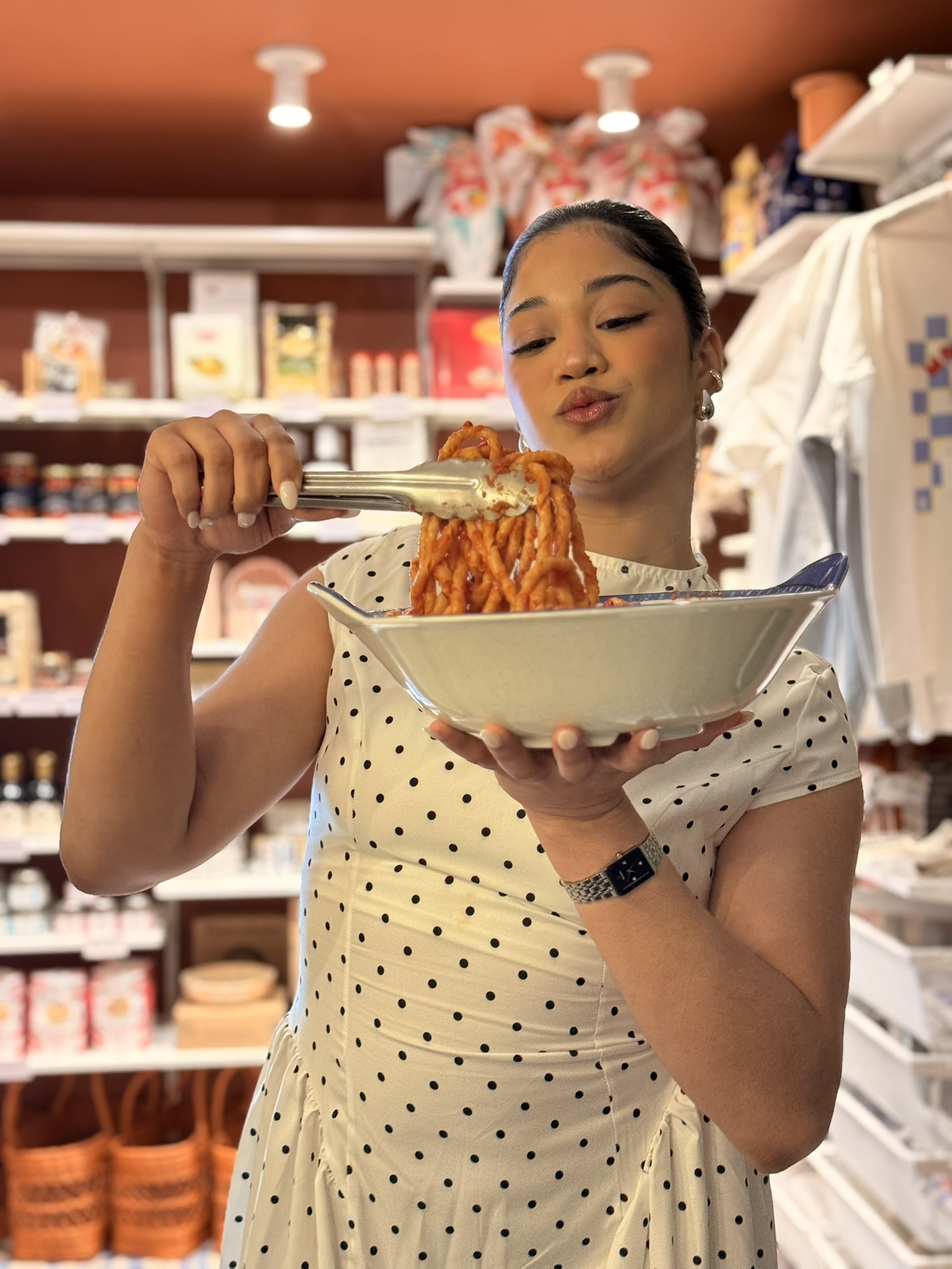 A Bottega guest sharing a plate of pasta